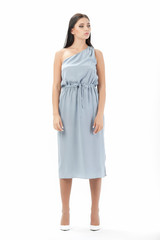 brunette posing in clothes for a catalog on a white background