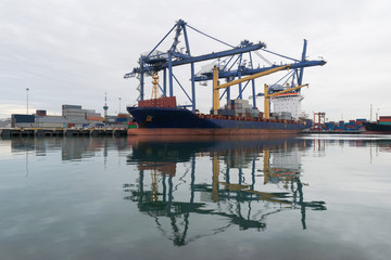 Container ship in asia port while load the job