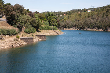 Fototapeta na wymiar shoreline of the Castelo do Bode lake, Central Portugal. A man made lake with a hydro electric dam. 
