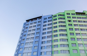 New-constructed multi-storey residential building. multi-storey residential house in brown and beige colors. Modern residential construction. Residential fund