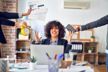 Group of business workers working together. Partners stressing one of them at the office