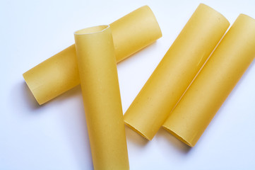 White background and Italian pasta pipe form from wheat in raw.