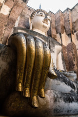 Giant rocky Buddha with extremely long fingers, Sukhothai