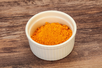 Tumeric powder in the bowl