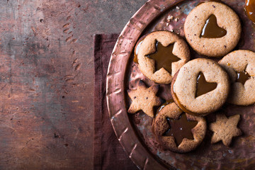 Homemade Christmas New year star shape  caramel cookies  over wooden  background. Flat lay, space.