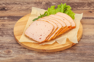 Boiled pork sausage over board