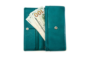 dollars in a female wallet isolated on a white background. View from above.