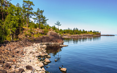 Steep coastal cliffs of Lake Ladoga. - 347900961