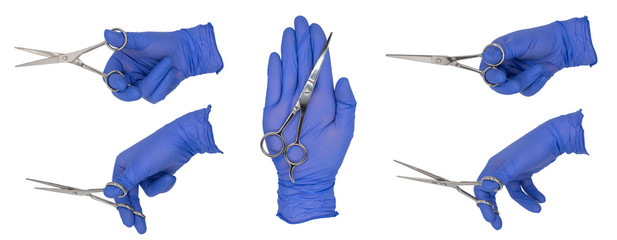 Woman's hand wearing a blue nitrile examination glove holding a pair of scissors in various poses. Isolated on a white background.  No Skin