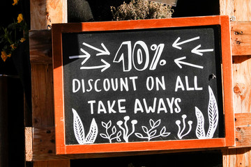 Kalmar, Sweden  The main shopping street Storgatan empty due to Covid-19, and a sign for 10% discoount on take away at a restaurant. © Alexander