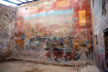 Roman frescoes in the ancient ruins of the City of Pompei, Naples, Italy