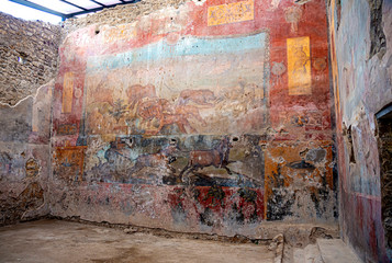 Roman frescoes in the ancient ruins of the City of Pompei, Naples, Italy