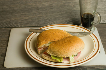 Ham salad sandwich and pot of coffee