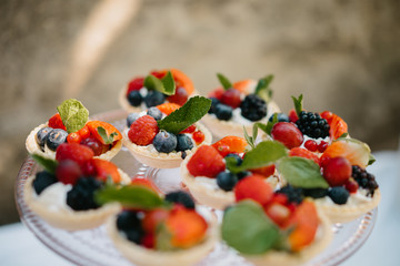 photo of small berries tartelette in a plate