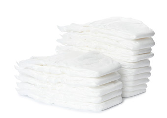 Stacks of baby diapers isolated on white