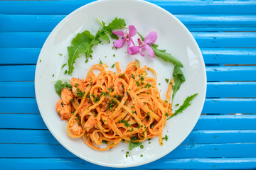 Top view of pasta with tomato sauce and cheese, homemade and restaurant  cooking on white background