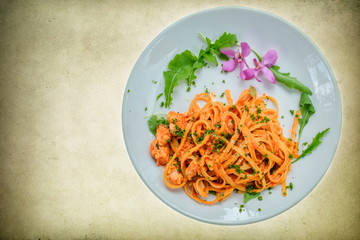Top view of pasta with tomato sauce and cheese, homemade and restaurant  cooking on white background