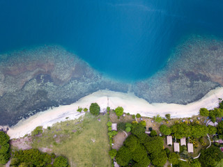 Lombok, Indonesia, south Gili islands. Aerial drone view from Gili Asahan island. .A strip of sand on the beach and blue sea with corals. - 347907920