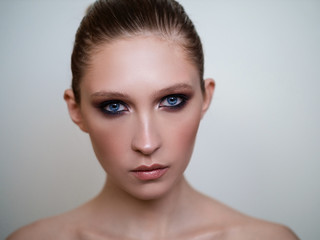 Beautiful woman model with  stylish makeup.  Glamour head shot.