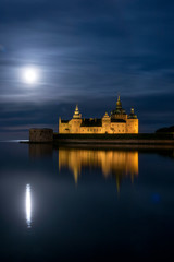 Fototapeta na wymiar Kalmar, Sweden The grounds of the Kalmar Castle at night and moonlight.