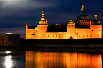 Fototapeta na wymiar Kalmar, Sweden The grounds of the Kalmar Castle at night and moonrise.