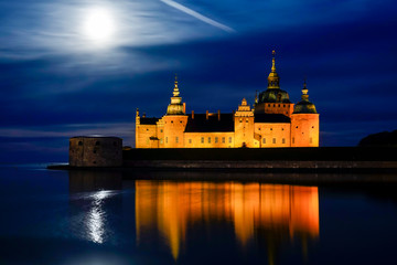 Kalmar, Sweden The grounds of the Kalmar Castle at night and moonrise.
