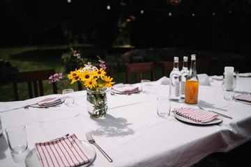 photo of a dinning table in the garden