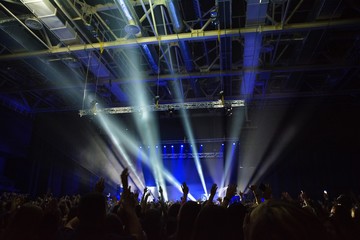 Fototapeta na wymiar concert a lot of people blue spotlights