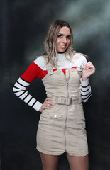 Beautiful, glamourous blonde girl posing in studio on isolated background. Style, trends, fashion concept.