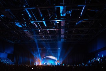 Fototapeta na wymiar concert a lot of people blue spotlights