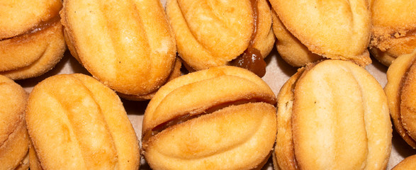 Nuts with condensed milk is the top view.Background from sand nuts with condensed milk.