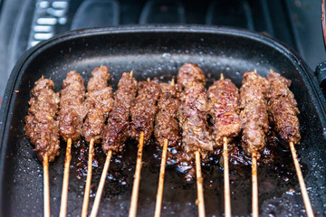 Chicken skewers or meat on the grill Indonesian food sate