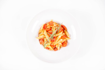 Penne with tomatoes, garlic and mozzarella decorated with rosemary twig, on a white background