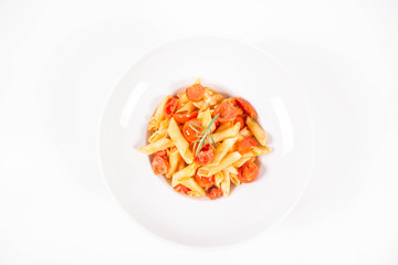 Penne with tomatoes, garlic and mozzarella decorated with rosemary twig, on a white background