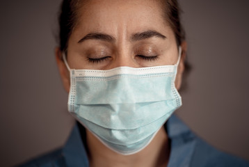 Female Doctor or Nurse Wearing Protective face medical Mask. Save lives from Covid-19 Outbreak