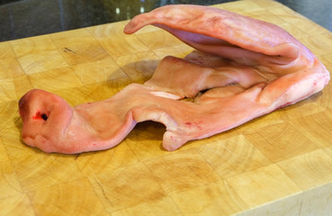 skin of half a pigs head, to be chopped and cooked as a dog treat 