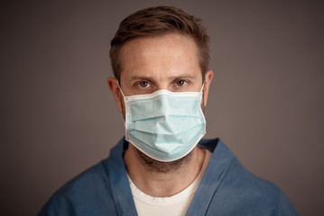 Man Doctor or Nurse Wearing Protective face medical Mask. Save lives from Covid-19 Outbreak