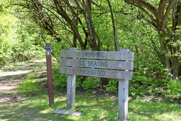 A close view of the old wood information sign.