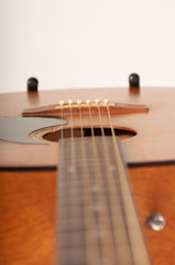 Single Old acoustic guitar on white background