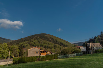 Fototapeta na wymiar Hills over Trojanovice village in spring sunny color evening
