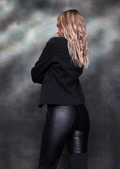 Beautiful, glamourous blonde girl posing in studio on isolated background. Style, trends, fashion...