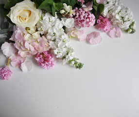white, cream, pink flowers on white background