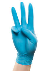 Male doctor hand in blue glove make gesture. Shot in studio. Isolated with clipping path on white background