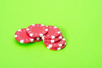 Casino chips on green background isolated