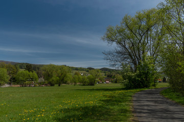 Fototapeta na wymiar Dolni Becva village in spring color fresh green day with church and meadows