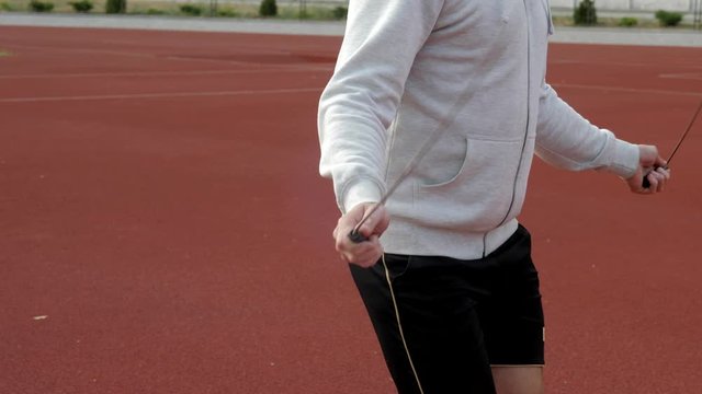 young man runner workout with jumping rope