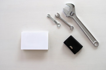 Male tools. Happy Father's Day inscription with screwdriver, Mechanic hand hold spanner tool, pliers Greetings. white card with the ability to insert text, copyspace, congratulation birthday for man, 