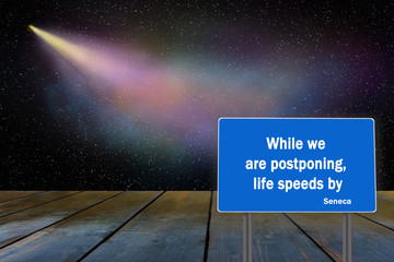 phrase of Seneca the Younger written on dark surface. Comet flying in distance