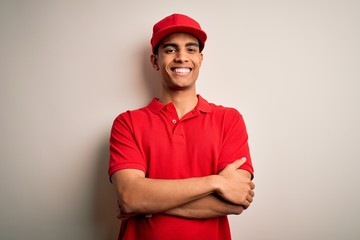 Young handsome african american man wearing casual polo and cap over red background happy face...