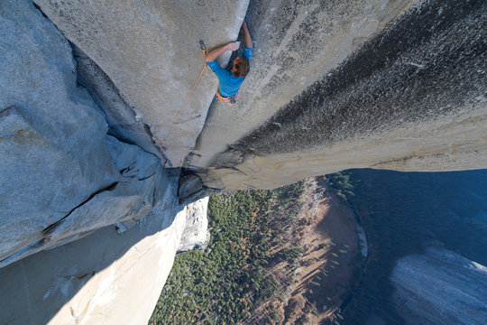 Climbing focused and looking up climbing hard on the Nose Yosemite